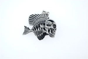 Close-up of gothic skull fishbone pendant with vintage oxidized titanium steel details