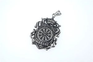 Detail of vintage steel shield pendant with crown and DARTS engraving for hip-hop style