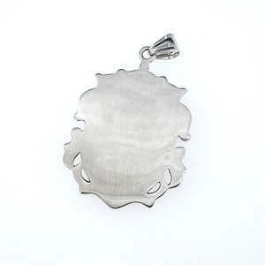Brushed stainless steel crown emblem pendant with decorative cutouts and matte finish