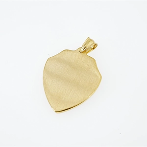 Minimalist gold shield pendant necklace in brushed stainless steel on a white background