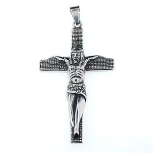 Vintage steel cross pendant with detailed Jesus relief on a textured silver background
