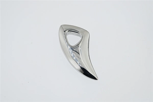 Macro view of polished silver wolf tooth pendant with smooth mirror finish and sleek curves
