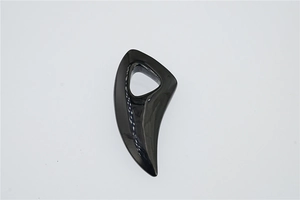 Close-up of sleek black wolf tooth pendant with smooth polished ceramic-like finish