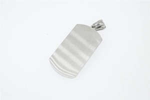 Macro detail of rectangle brushed titanium steel military dog tag pendant with silver finish