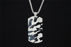 Macro shot of a hip-hop camo pattern dog tag pendant with silver box chain necklace