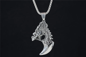 Detailed close-up of a silver dragon head and beast claw pendant in gothic punk style