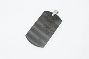 Close-up of hip hop style dog tag pendant in dark grey brushed finish stainless steel