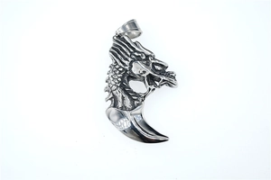 Detailed view of punk wolf fang pendant with intricate dragon scale textures in steel