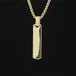 Minimalist gold rectangular bar pendant necklace with box chain for men on black background