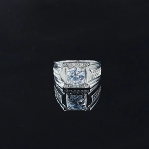 Elegant men's silver ring with round moissanite center stone and pavé set small diamonds