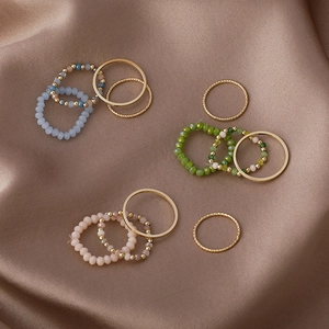 4-piece Korean style colorful crystal beaded ring set with gold metal bands for stacking