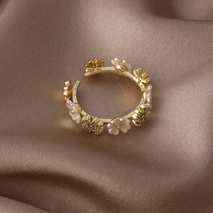 Elegant gold flower open ring with white shell petals and sparkling zircon accents