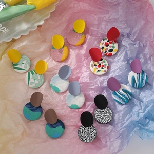 Abstract geometric round handmade clay earrings with vibrant color blocking and patterns