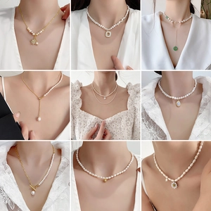 Collection of Baroque freshwater pearl necklaces with various gold pendant designs