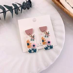 Floral clay drop earrings with colorful 3D flowers in a romantic pastoral style