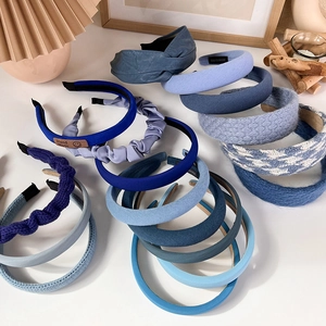Detail view of assorted Klein blue headbands with various textures and sponge padding