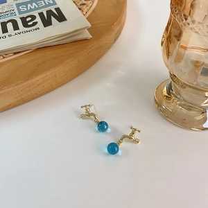 Creative gold faucet earrings with translucent blue crystal ball drops and fine details
