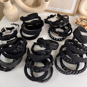 Variety of elegant black headbands including braided pearl and velvet textures for women