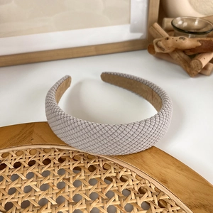 Close-up of light grey waffle texture fabric headband with soft padded design