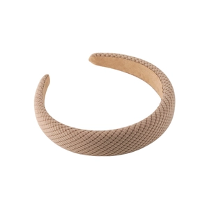 Brown padded headband with vintage diamond pattern weave on a clean white background