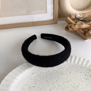 Detailed close-up of handmade knit velvet headband with elegant French pearl texture