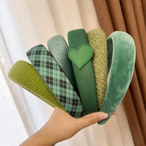 Set of six vintage green padded headbands in various textures like velvet and wool