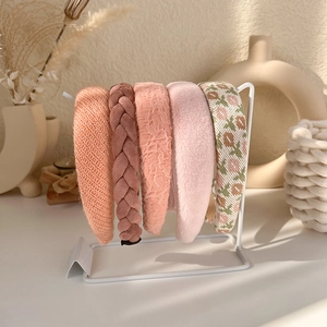 Detailed collection of pink padded headbands in velvet, lace, and floral fabrics
