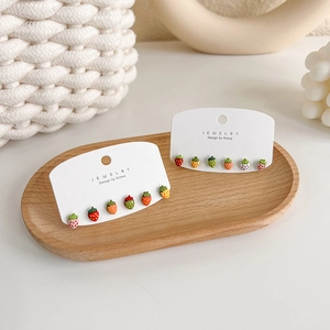 Cute multi-colored strawberry stud earring set with 925 silver needles on a jewelry card