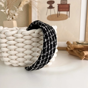 Detail shot of black and white tweed pattern fabric on a classic French style headband