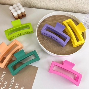 Matte candy color square hair claws in six vibrant shades on a minimalist background