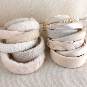 Collection of cream beige headbands in various textures like velvet, satin and pearls
