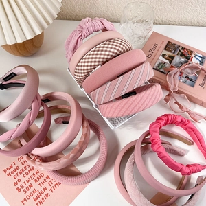 Pink fabric headband set with padded sponge design in checkered and striped patterns