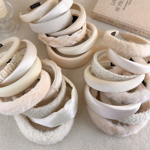 Detailed close-up showing texture and premium materials of cream beige padded headbands
