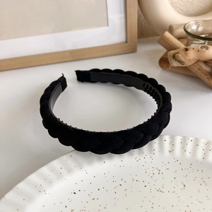 Detail shot of the braided black velvet texture and internal teeth for secure grip