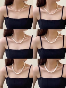French style glossy pearl necklace shown in 4mm to 14mm sizes on a model