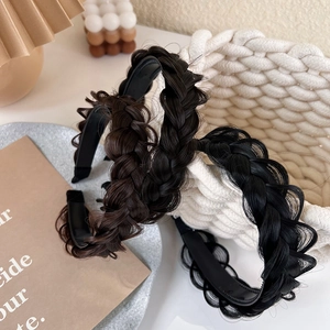Detail of fishtail braid headbands in black and brown, showing realistic hair texture
