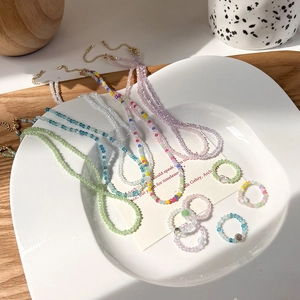 Set collana e anello con perline di cristallo sfaccettato e chiusura a moschettone oro