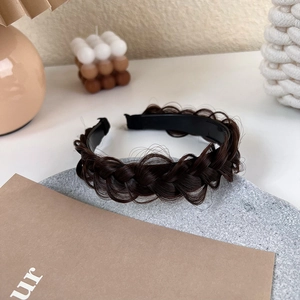 Macro shot of dark brown fishtail braid headband with anti-slip inner teeth texture