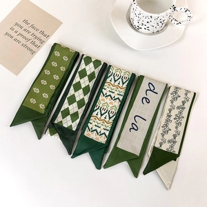 Elegant green narrow silk scarf for women featuring diverse vintage patterns and prints