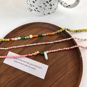 Handmade freshwater pearl beaded necklaces with colorful stone accents and baroque pearls