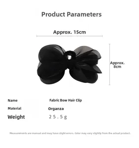 Detail view of large black organza bow hair claw clip with dimensions 15cm x 8cm