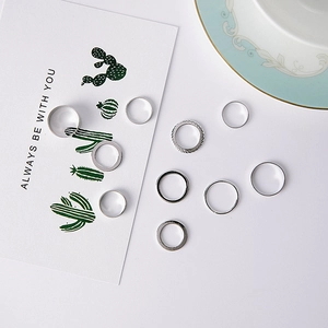 10-piece silver minimalist stackable ring set with smooth and twisted designs for women
