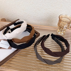 Detail of twisted fabric headbands showing inner non-slip teeth in multiple colors