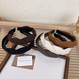 Detail of twist knotted headbands with non-slip teeth in five elegant matte fabric colors