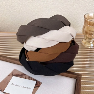 Collection of twisted wide headbands in neutral earth tones with twill fabric texture