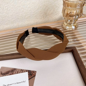 Close-up of coffee brown twisted headband with twill texture and anti-slip lining detail