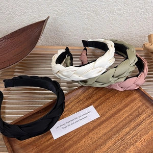 French vintage braided satin headbands in four colors on a wooden tray for women
