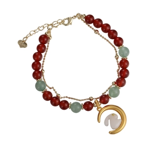 Double-layered beaded bracelet with red agate, jade beads, and a gold rabbit moon charm
