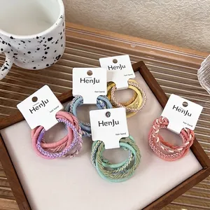 Set of 5 braided elastic hair ties in pastel candy colors on white display cards
