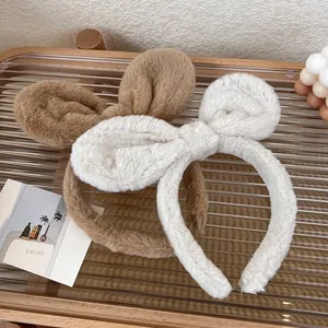 Plush bunny ear headband set in brown and off-white for face washing and styling
